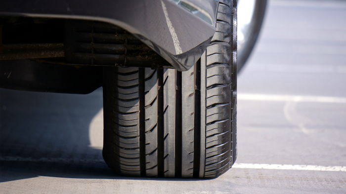 car tyre or wheel on tar road