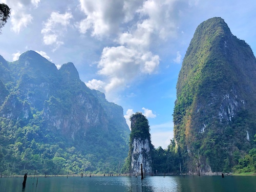 lake at khao sok national park with limestone cliffs and crystal clear waters