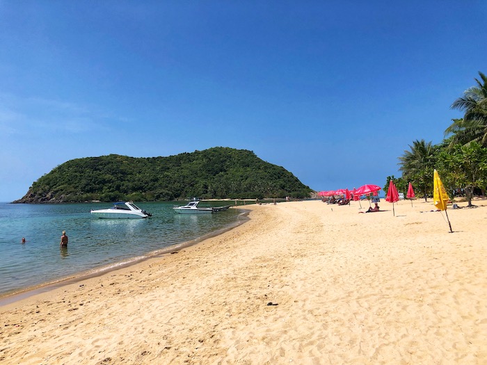 mae haad beach in koh phangan with koh mah island in the background