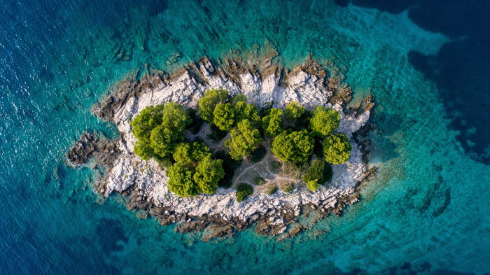 an aerial view of an island that is known for being one of the best scuba diving destinations in the world