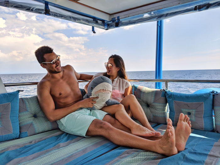 a couple on a liveaboard diving trip around Similan Island in Thailand