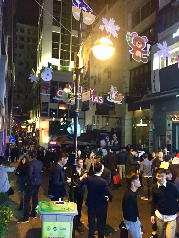 locals and expats gathering at famous nightlife district in hong kong lan kwai fong