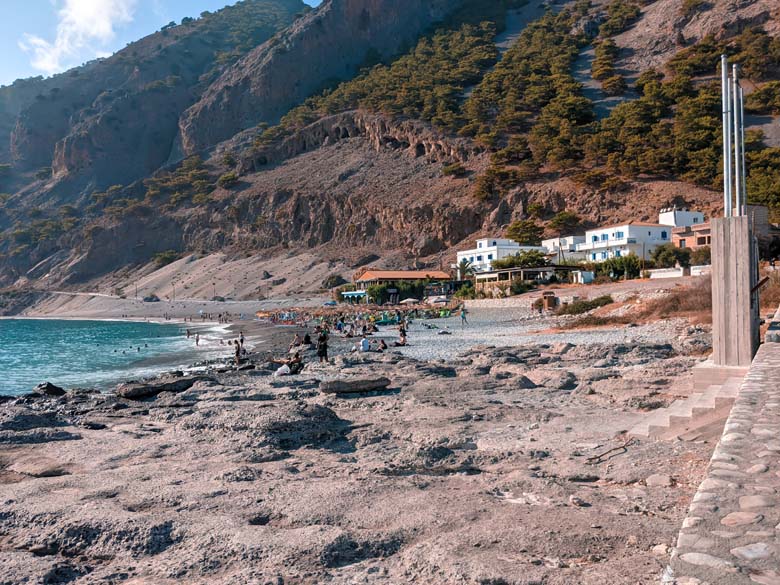 a view of the coastal town agia roumeli in south crete with its black sand beach