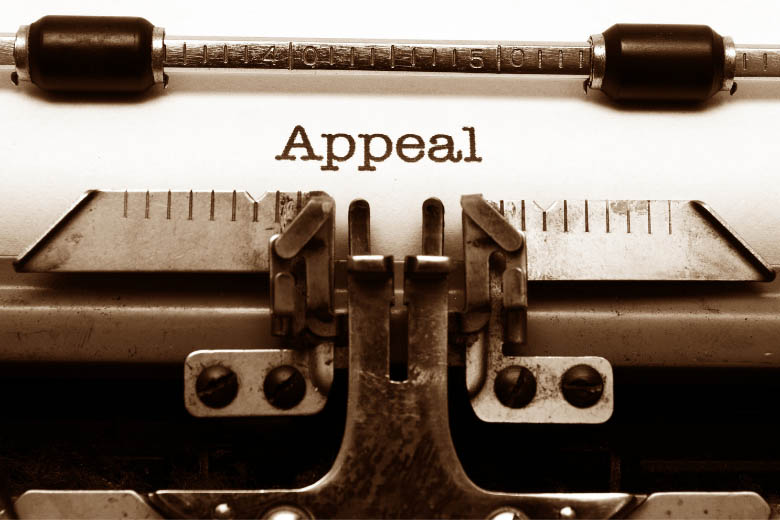 the word appeal typed out on a white sheet of paper