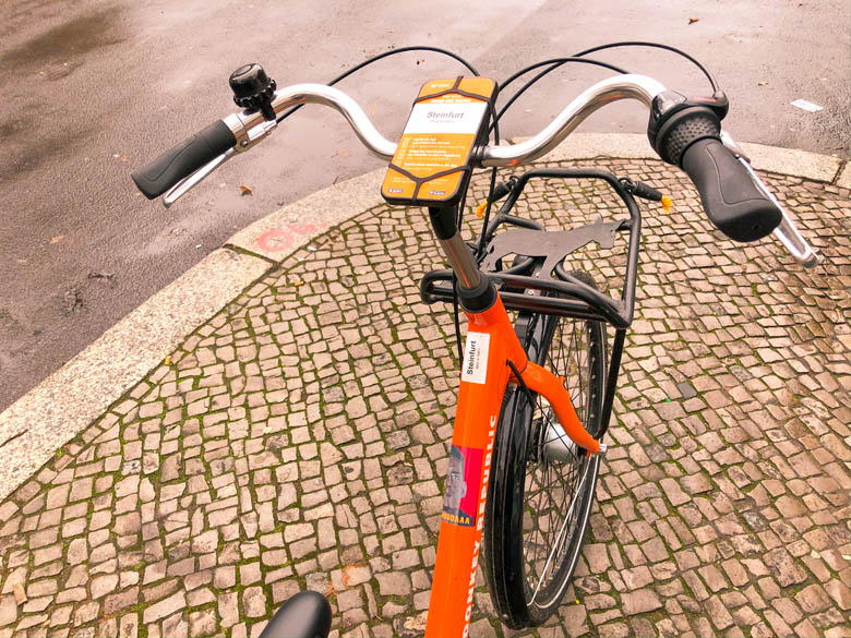 an orange donkey republic bicycle