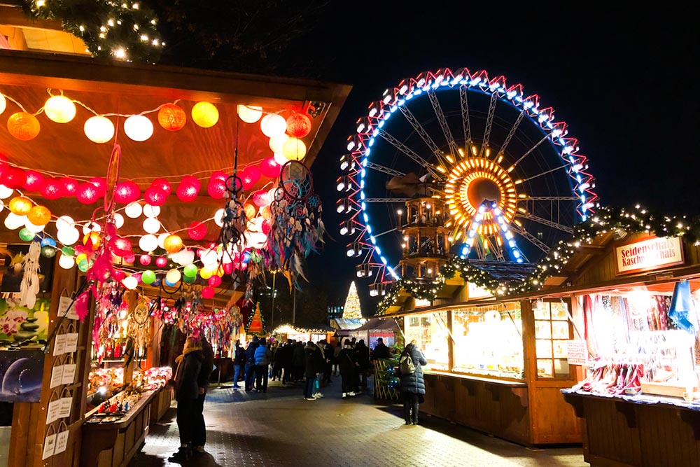 german christmas markets in berlin with ferris wheel and lights in 2020