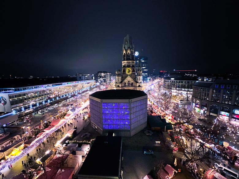 a view of a popular berlin christmas market from a hotel rooftop 