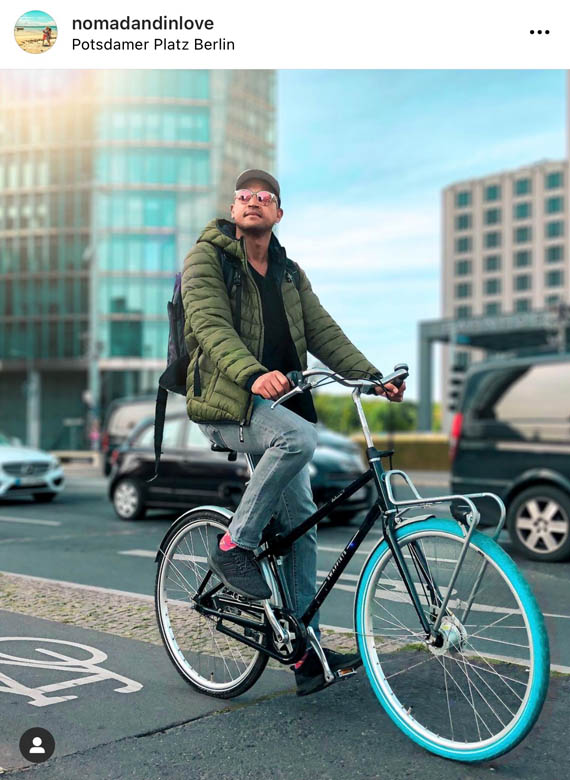 man cycling on swapfiets bike in a bicycle lane in berlin germany