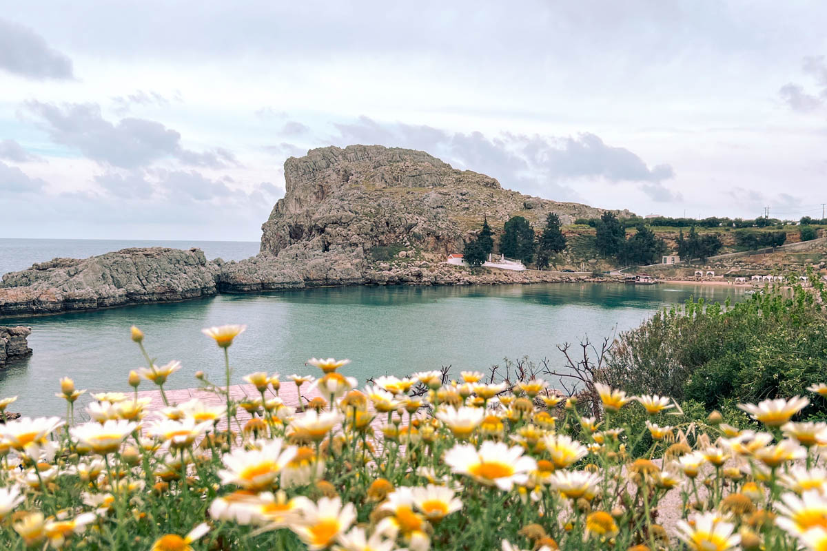 a view of st pauls bay beach near the acropolis of lindos in rodos