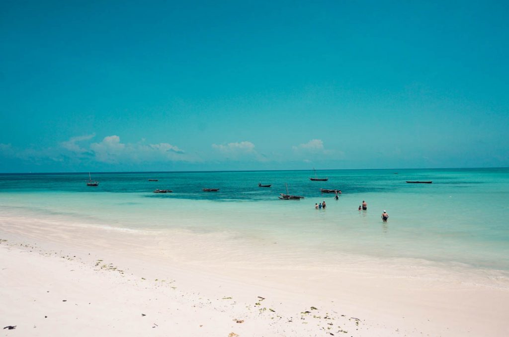 crystal clear turquoise waters and white sand at nungwi beach on zanzibar island tanzania