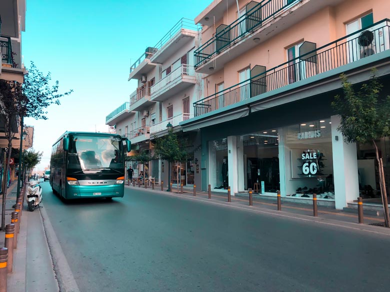 a turquiose minoan line bus that is the main form of public transportation on crete island greece