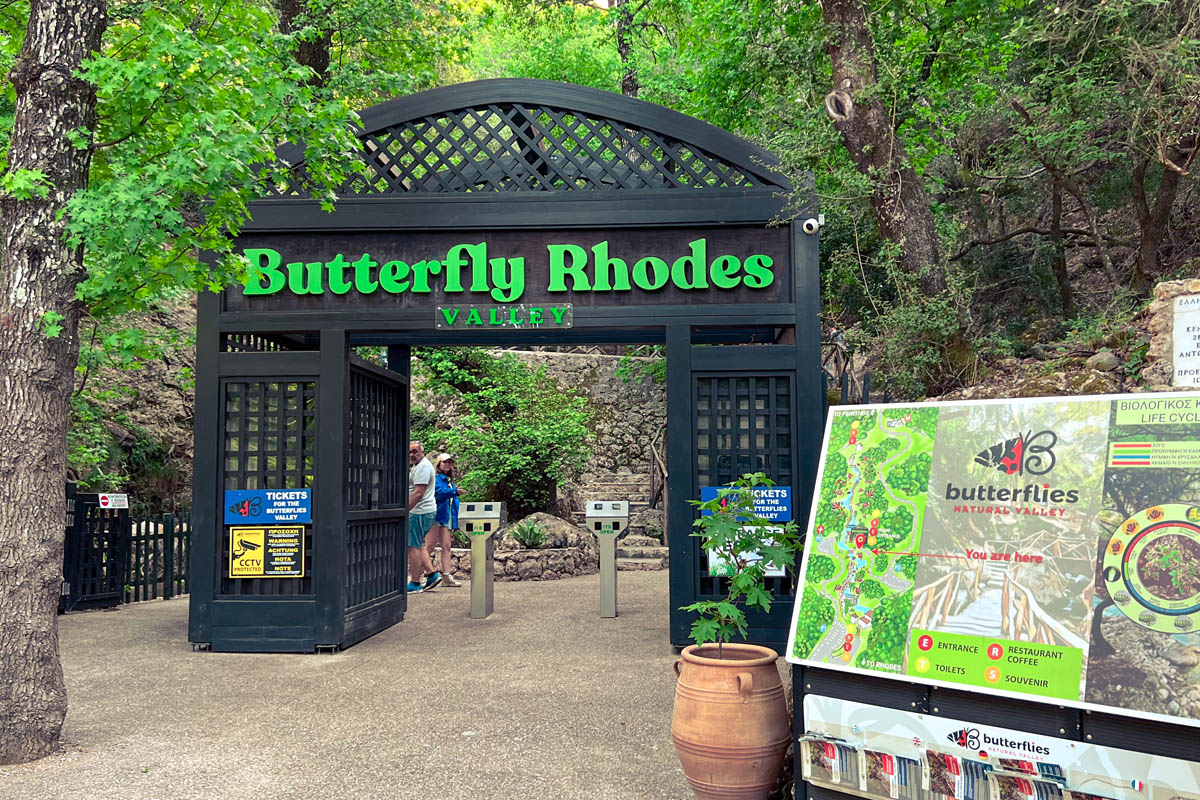 the entrance to butterfly valley in rhodes with visitors information in the foreground