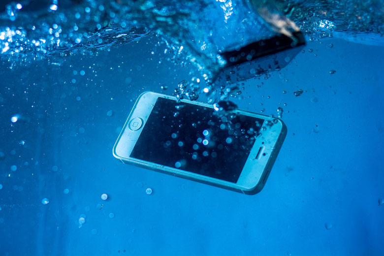 an iphone submerged underwater