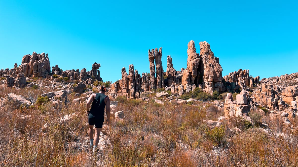 a man hiking in cederberg mountains to wolfberg arch