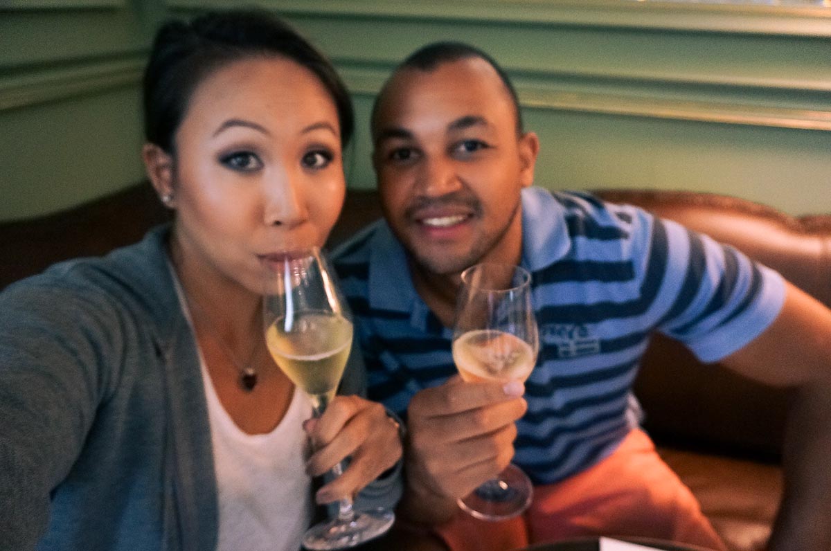 a couple taking a selfie on honeymoon whilst wine tasting along the constantia wine route