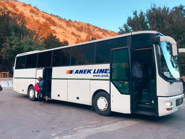 a white public bus in crete that goes from chania to samaria gorge
