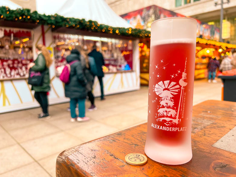 a german christmas market mug with rose gluhwein in it at alexanderplatz berlin