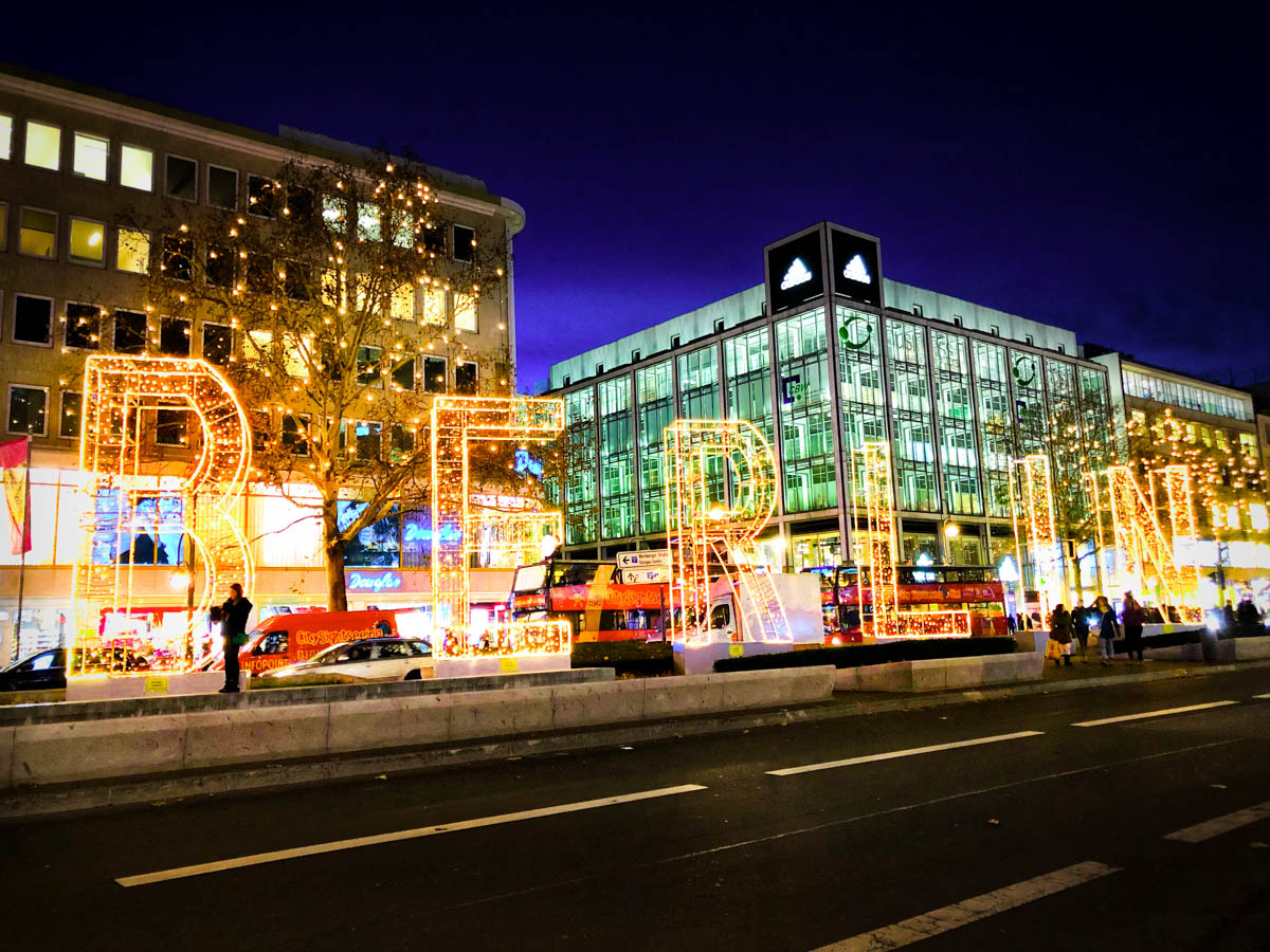 a berlin light installation in december along tauentzienstrasse with the longest christmas lights in the world in the background