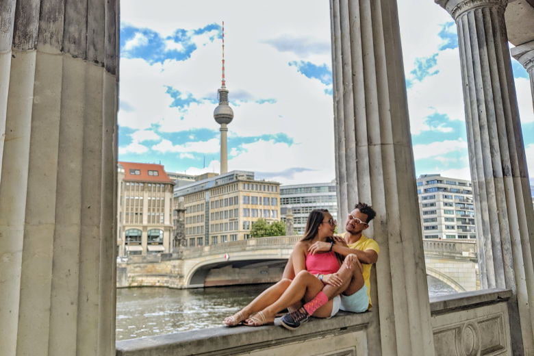 a couple sitting at Museum Island in Berlin sharing their experience and cost of living in Berlin