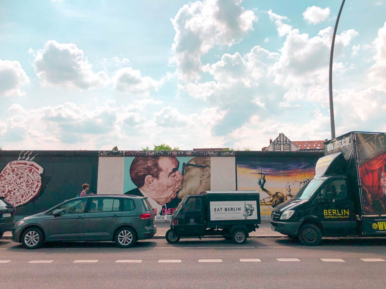 famous berlin kissing graffiti at east side gallery in Friedrichshain-Kreuzberg neighborhood in Berlin