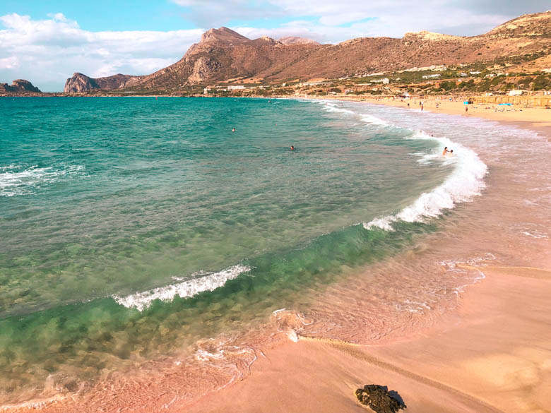 falasarna beach - the other pink sand beach on west crete in greece surrounded by beautiful mountain views