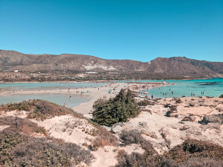 a view of elafonisi pink sand beach with the shallow lagoon on the one side and the sea on the other 