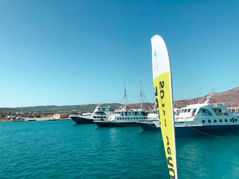 a row of ferries docked at kissamos port heading to balos beach and gramvousa island in kreta greece