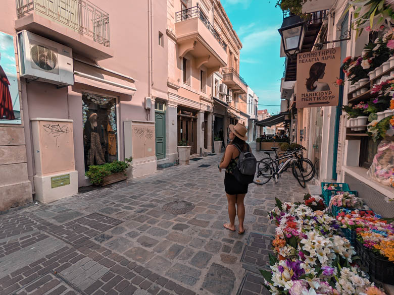 a traveler walking through the town centre of rethymno on the biggest island in greece