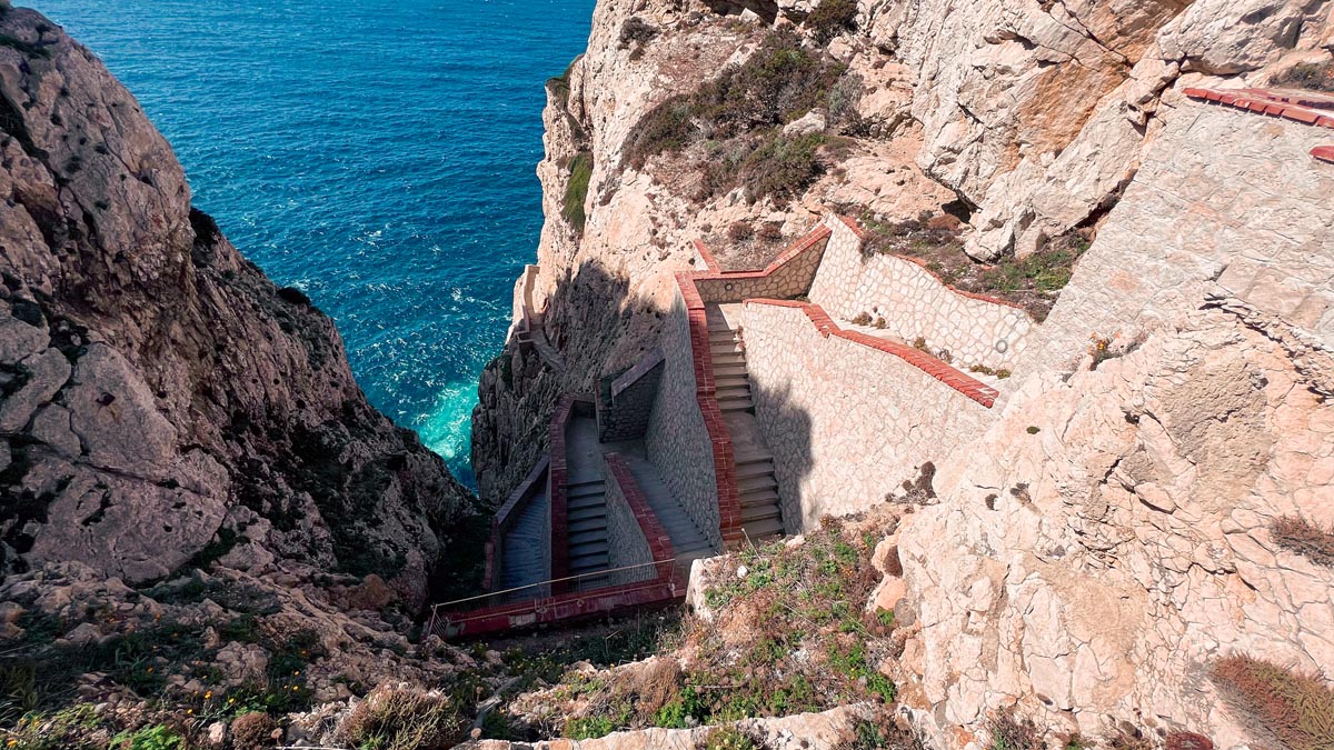 the famous escala del cabirol or roe deer's stairway to get to neptune's grotto near alghero in north west sardinia italy