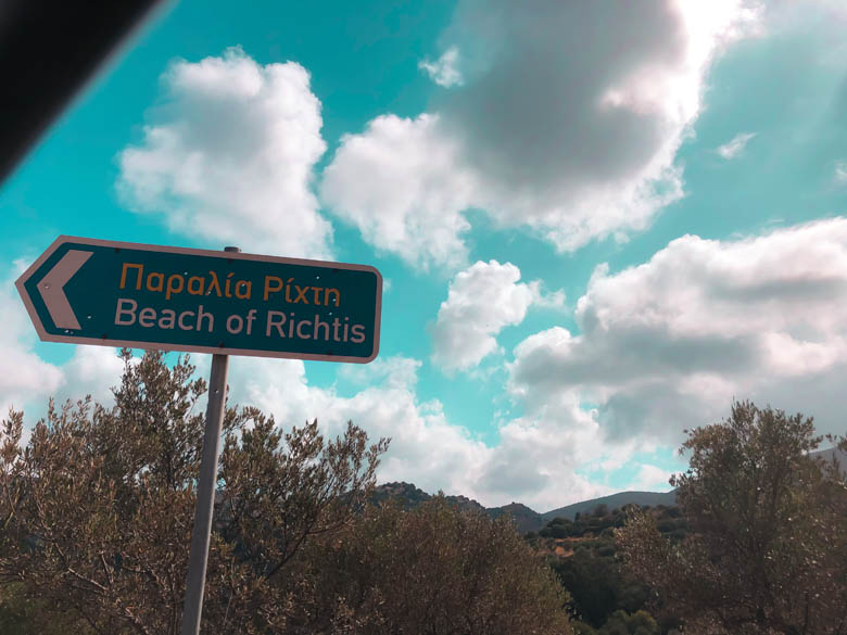 a road sign pointing to richtis gorge beach in crete greece