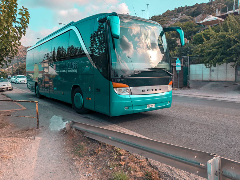 a turquoise ktel bus that is the main public transportation in crete greece
