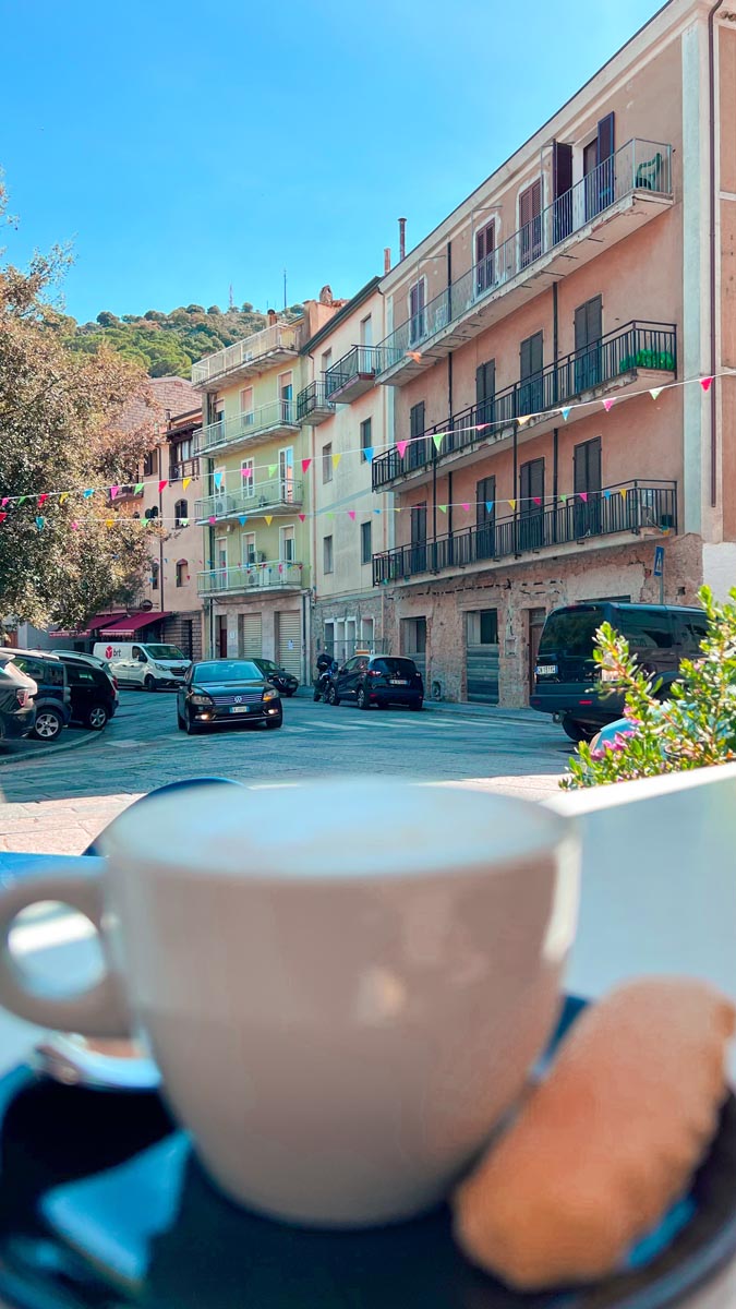 enjoying a coffee and biscotti at a small village bitti in sardinia whilst on a road trip around the island