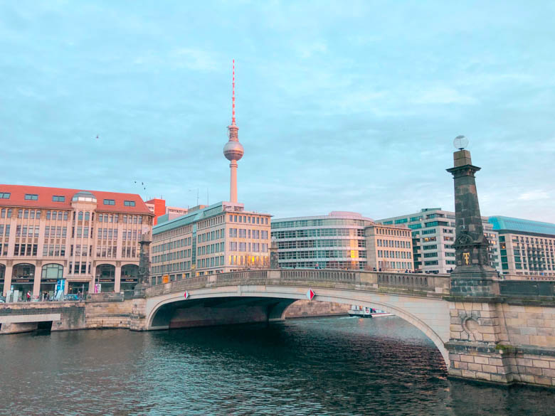 buildings across the bridge in Berlin from Museum Island and a view of apartments, offices and the Berlin Fernsehturm in the background