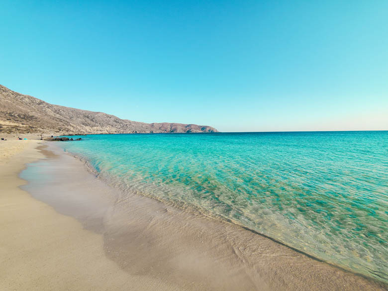 crystal clear turquoise waters on a quiet hidden gem beach on west crete called kedrodasos beach