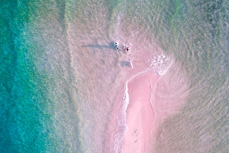 drone shot of turquoise crystal clear ocean and beautiful beach in thailand koh phangan island