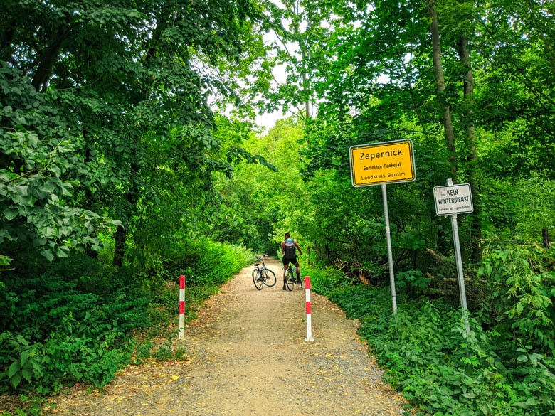 a man on a bike cycling in the bicycle path from berlin to liepnitzsee 