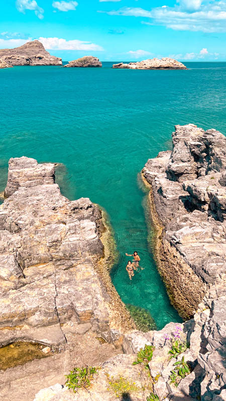 people snorkeling in sea caves near lindos rhodes