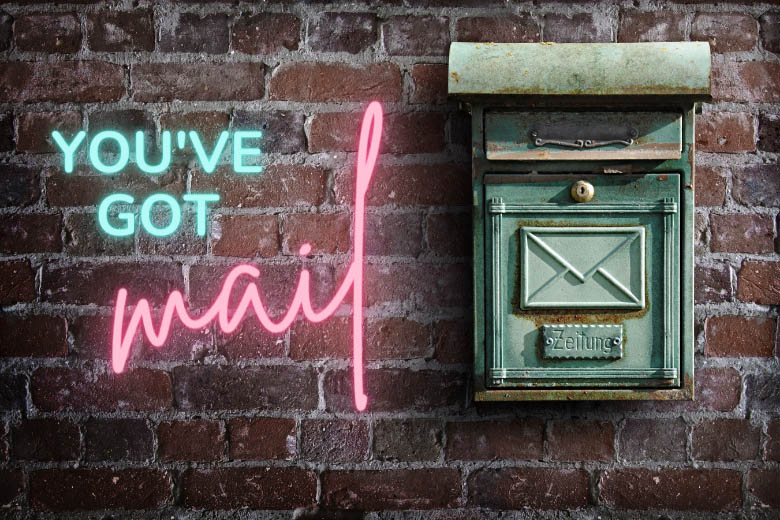 an old post box in Germany with the word 'zeitung' on it and the words 'You've got mail' in neon