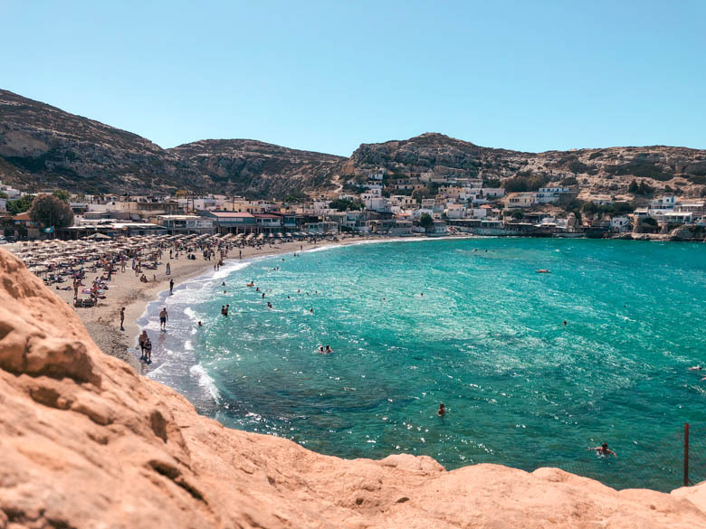 an aerial view of matala beach from matala caves as part of a south crete travel itinerary