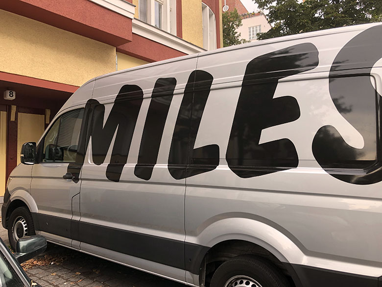 a gray miles carsharing van parked in berlin germany