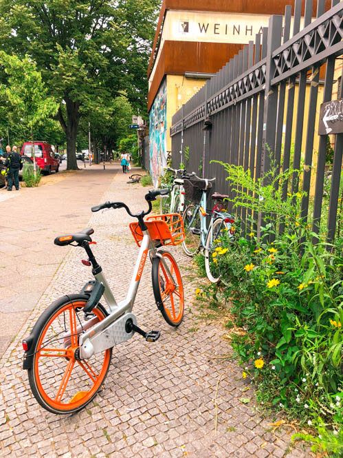 mobikes parked on the pavement in berlin