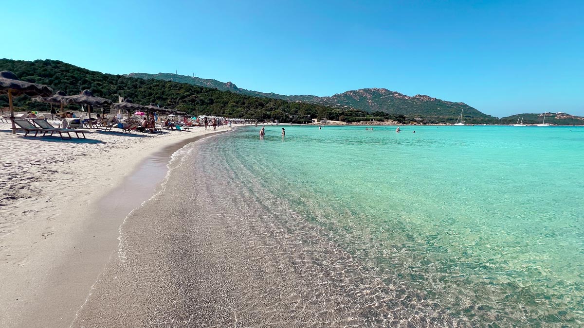 grande pevero beach in north east sardinia with turquiose blue crystal clear waters and a white powdery sandy beach in late september early october