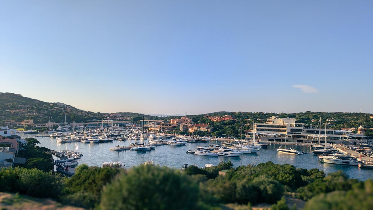 a viewpoint over the luxury harbour of porto cervo and surrounding hotels and luxury vacation apartment stays in sardinia