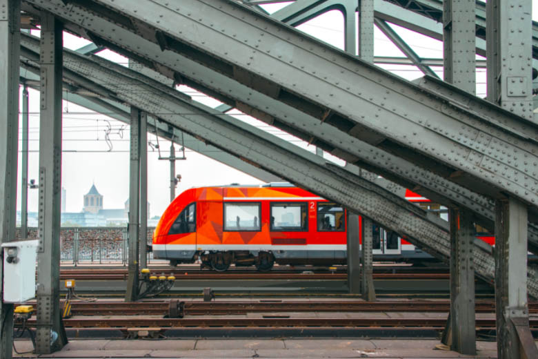 a red and gray deutsche bahn long distance train is the main regional public transport in germany