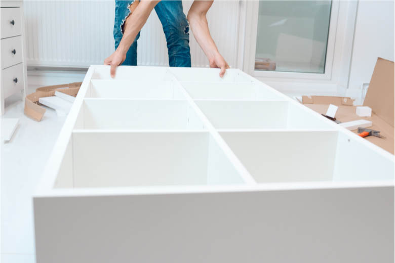 a person assembling their furniture in germany in preparation for a move