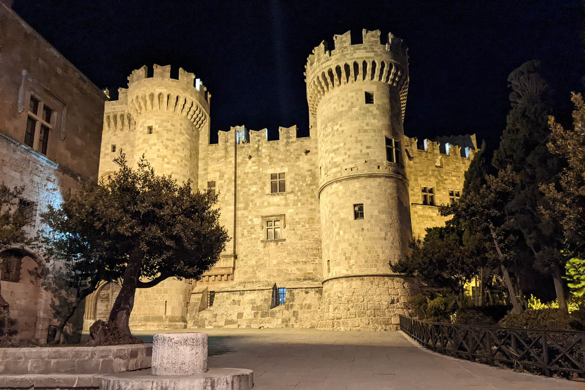 the palace of the grand master building lit up at night