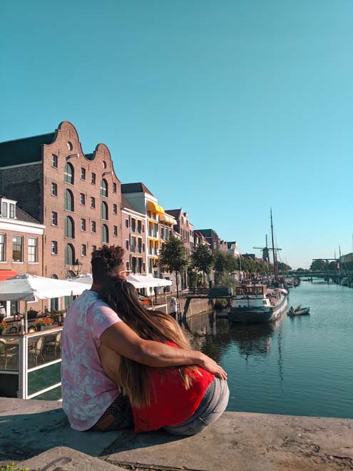 instagrammable spot in rotterdam with windmill in backdrop