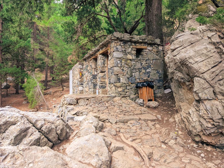 a stone structure in the forest which serve as toilets 