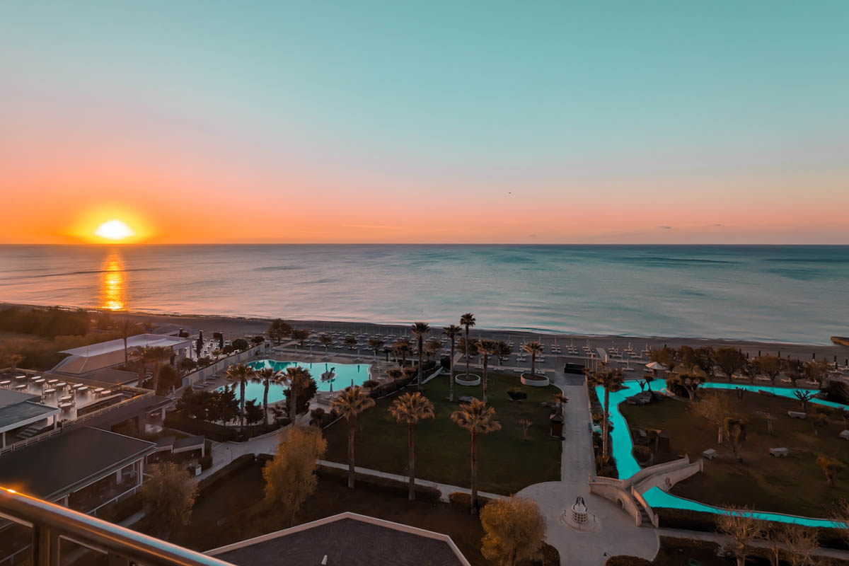 sunrise on faliraki beach from the balcony of a beachfront resort and hotel in rhodes greece