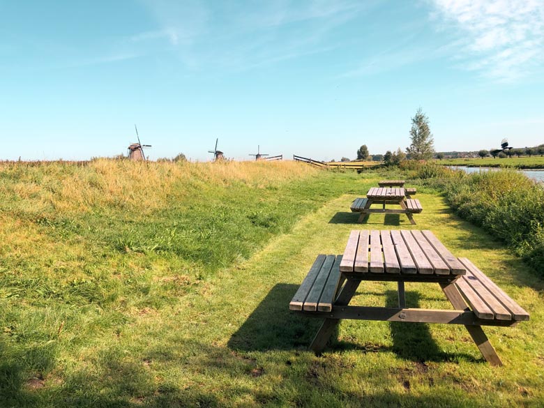 european countryside with picnic benches 